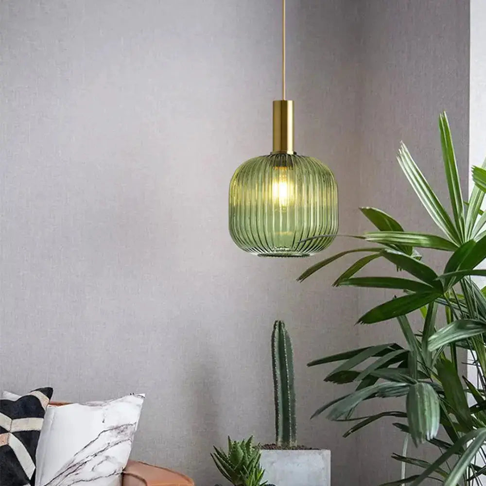 Pendant lamp with green ribbed glass and brass top for living room decor