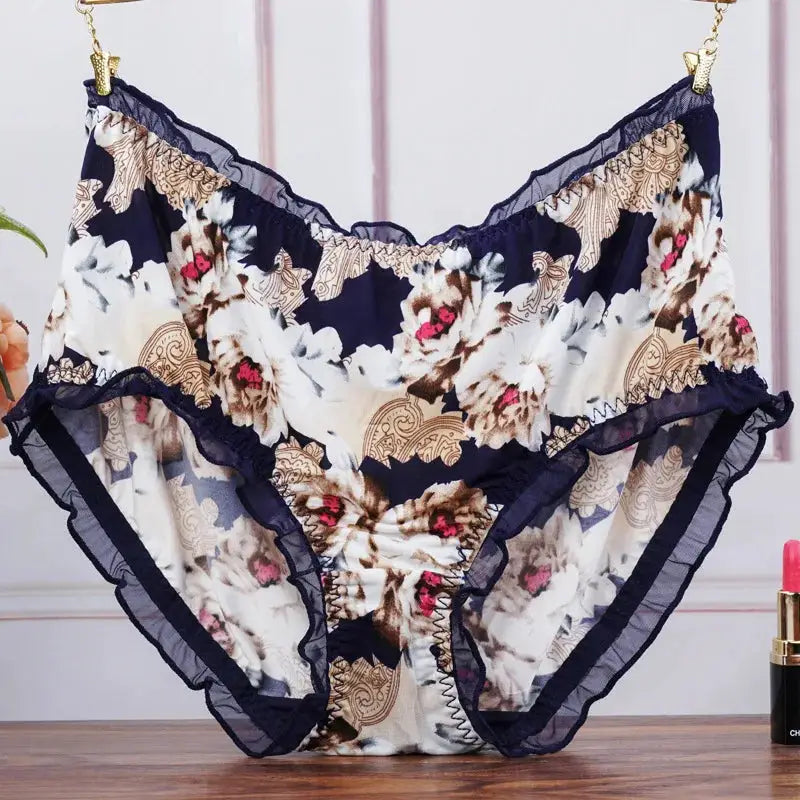 Women's big-size mid-waist floral print panties with navy lace trim and ruffled edges