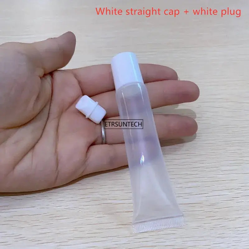 Clear lipstick tube with white cap, handheld, ETRSUNTECH label