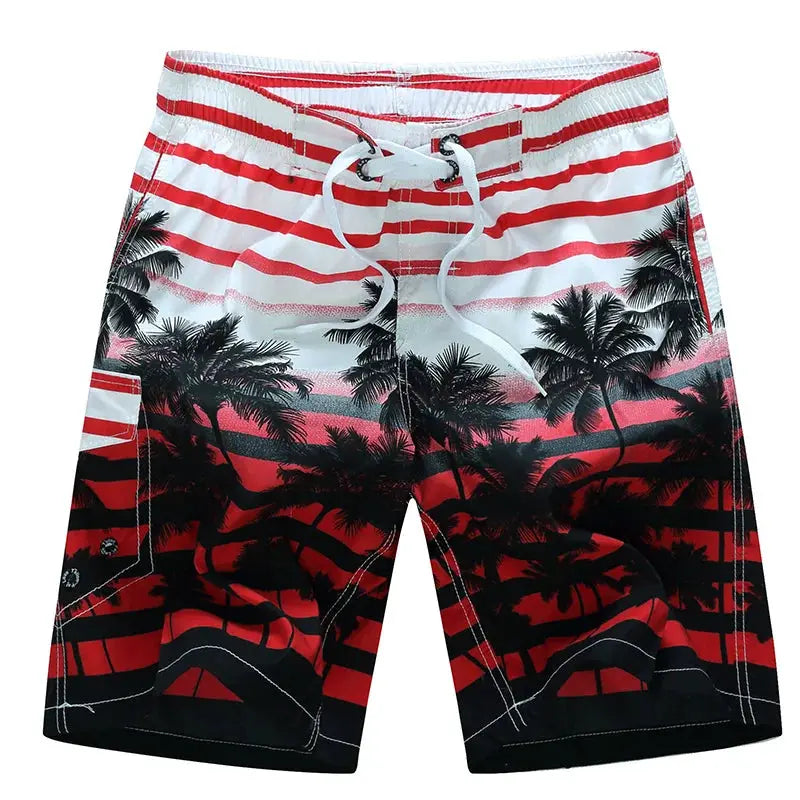 Men's surf board shorts with red-to-black palm tree sunset print and white drawstring