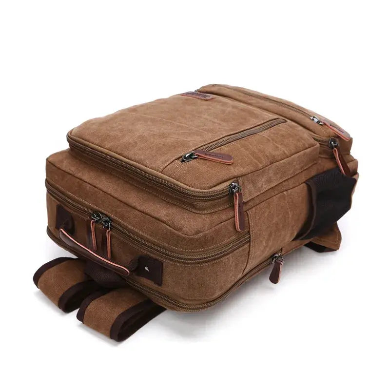 Vintage brown canvas backpack by Simples Market with multiple zip pockets and large capacity