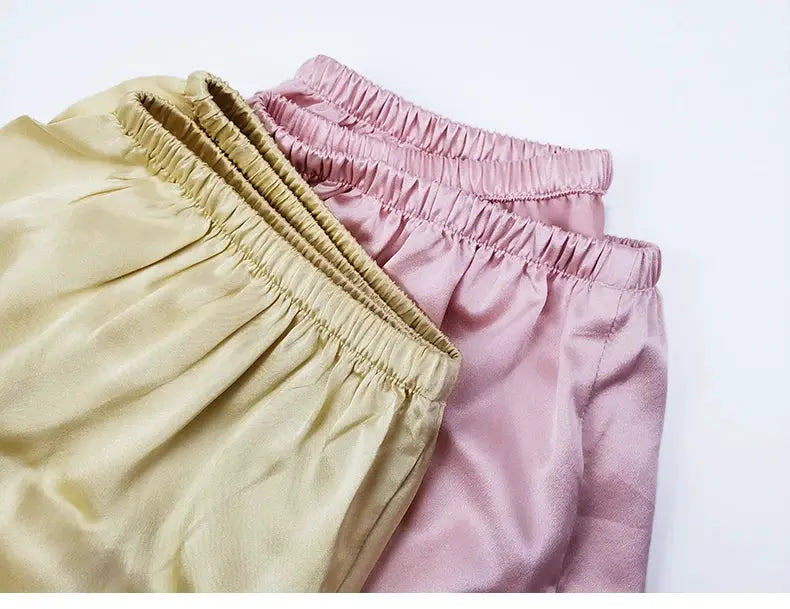 Two SuyaDream women's 100% silk shorts with elastic waist in beige and pink