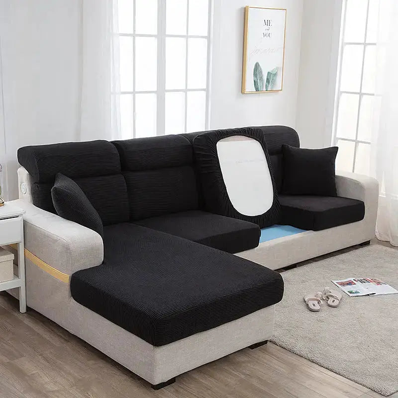 Sofa seat cover by Simples Market; elastic thickened protective black fabric on a gray L-shaped sectional
