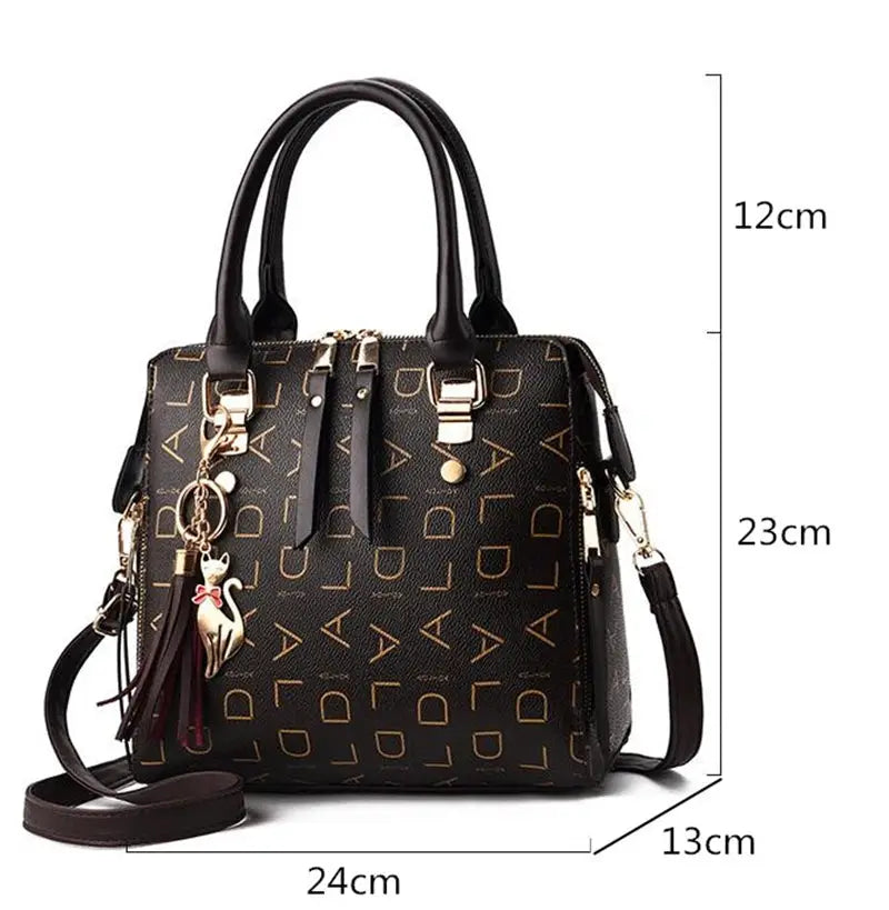 Simples Market black PU leather handbag with letter pattern, tassel charm, top-handle and detachable shoulder strap