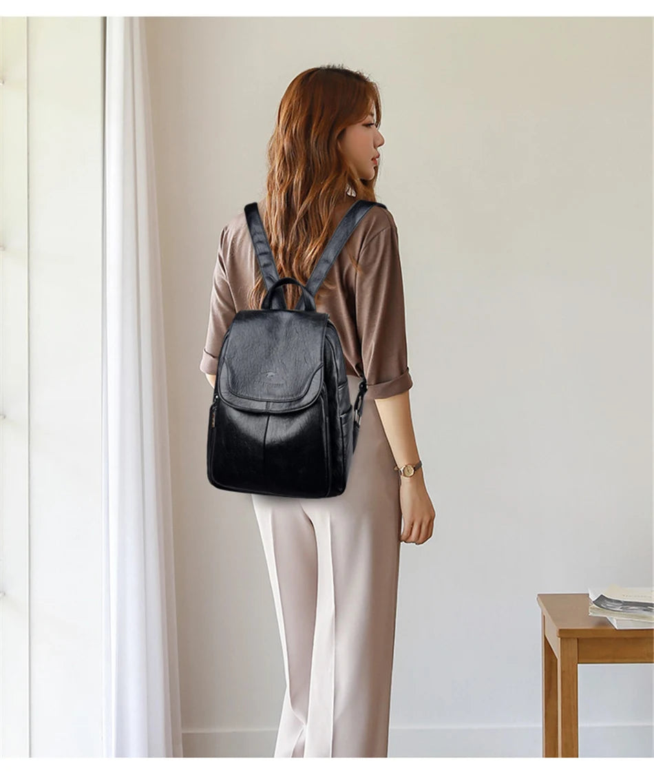 Genuine women's soft leather backpack in black with adjustable shoulder straps