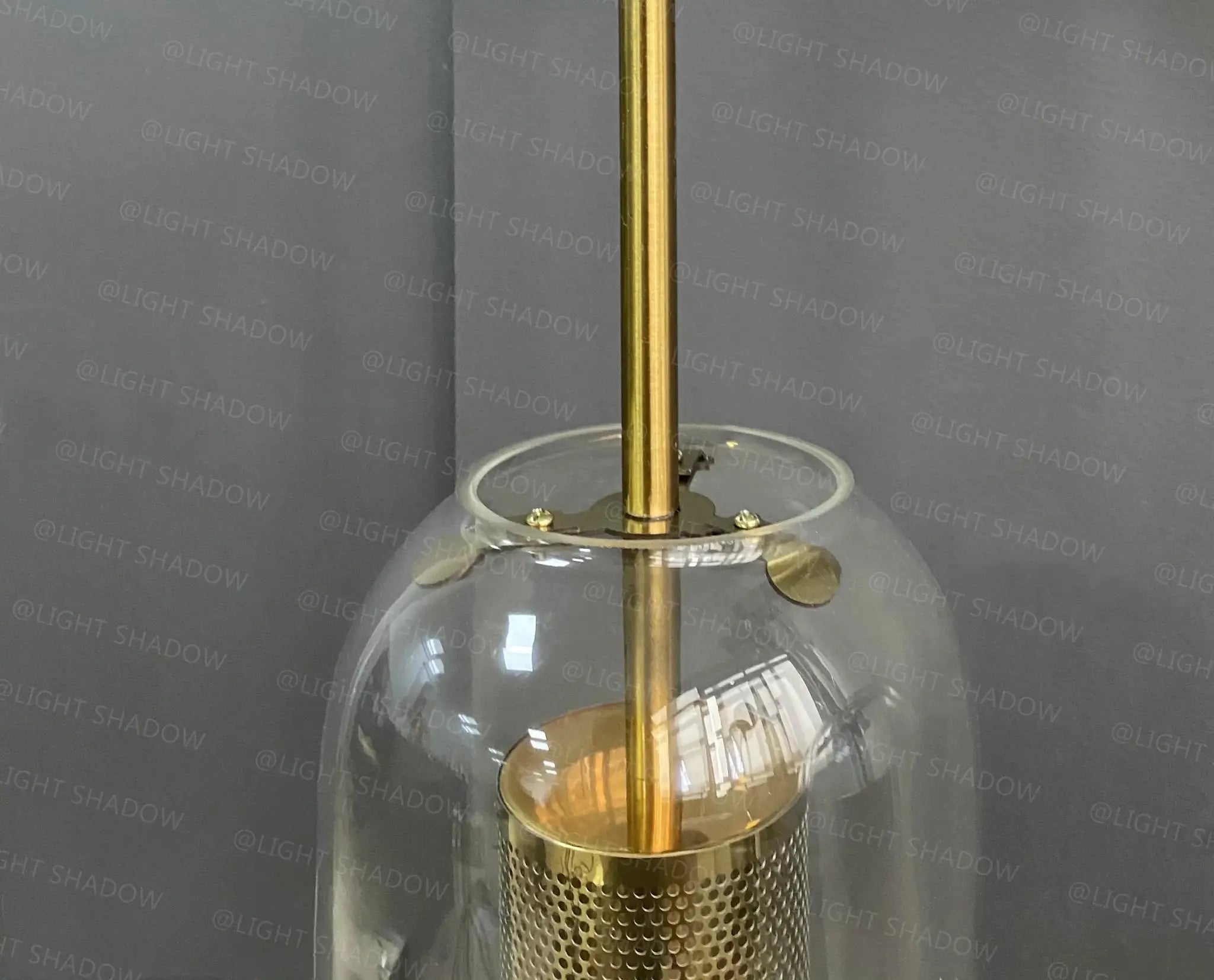 Simples Market modern glass wall light sconce with brass stem and clear glass globe.