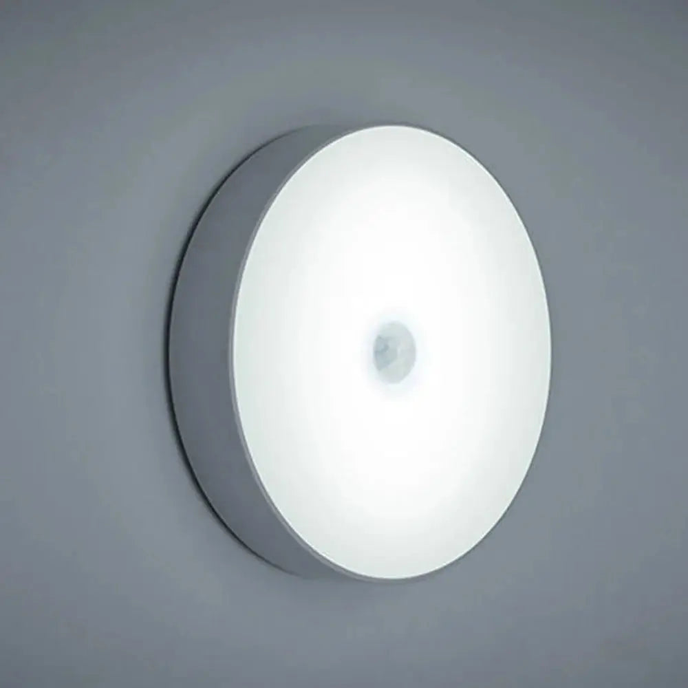 Round LED night light with motion sensor, white wall-mounted lamp