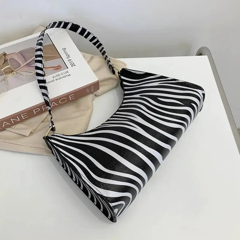 Shoulder bag for women with zebra print PU leather and black-white striped handle