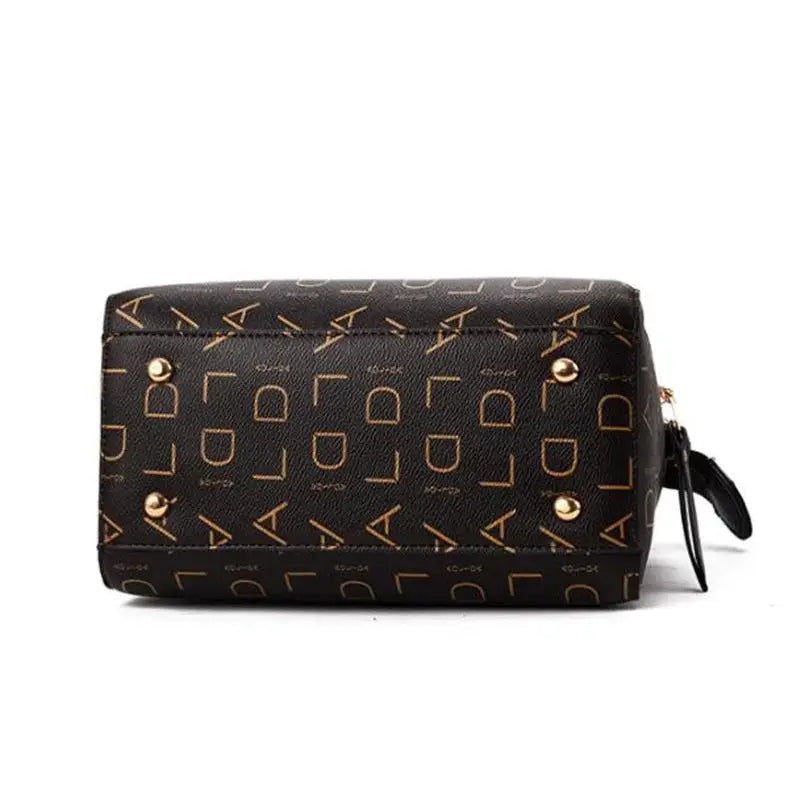 Handbag Simples Market, black PU leather with gold letter pattern, tassel detail, top-handle tote