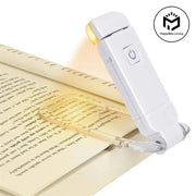 LED book light, white USB-rechargeable with clip-on and power button; MagicBox Living logo visible.