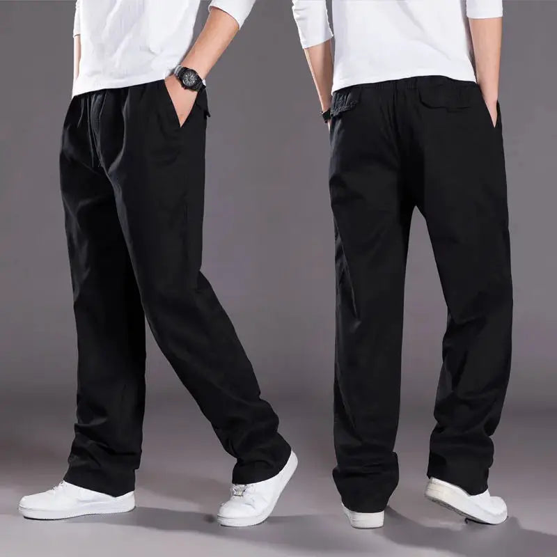 Men's cargo pants by Simples Market, black cotton workwear joggers; two pairs shown with white sneakers