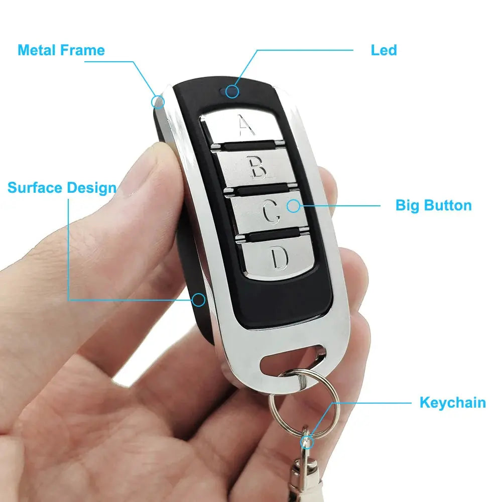 Simples Market 4-in-1 garage remote key fob with metal frame, black body, four silver buttons, and keychain