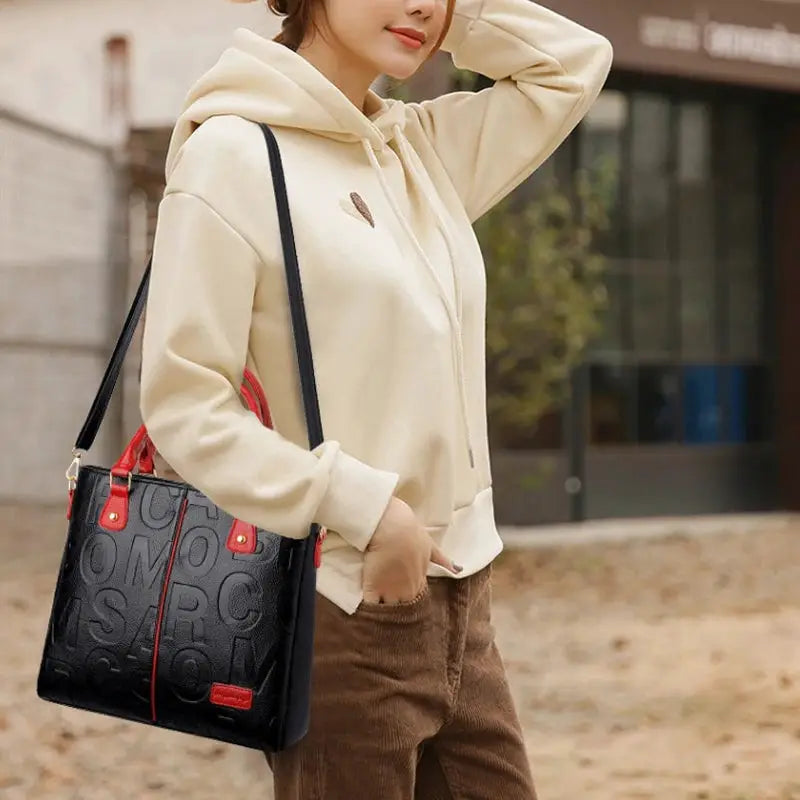 Simples Market PU leather crossbody bag for women, black embossed pattern with red accents