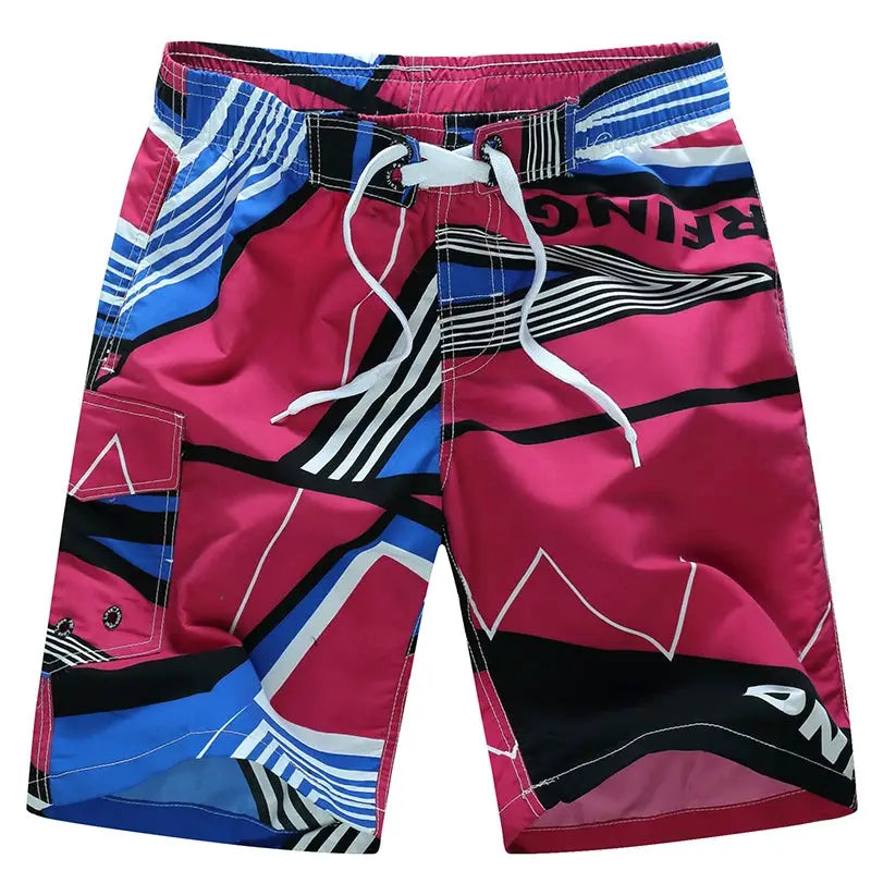 Men's surf board shorts in pink with blue and black geometric pattern, white drawstring, cargo pocket.