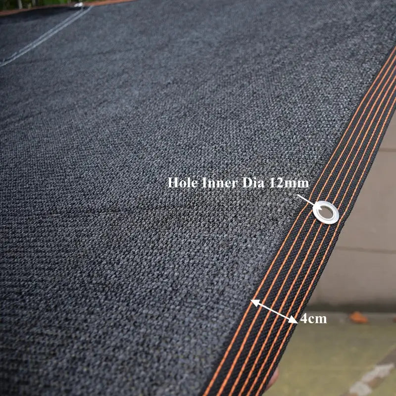 HDPE sunshade net by Simples Market in black with orange edge stitching and 12mm grommet