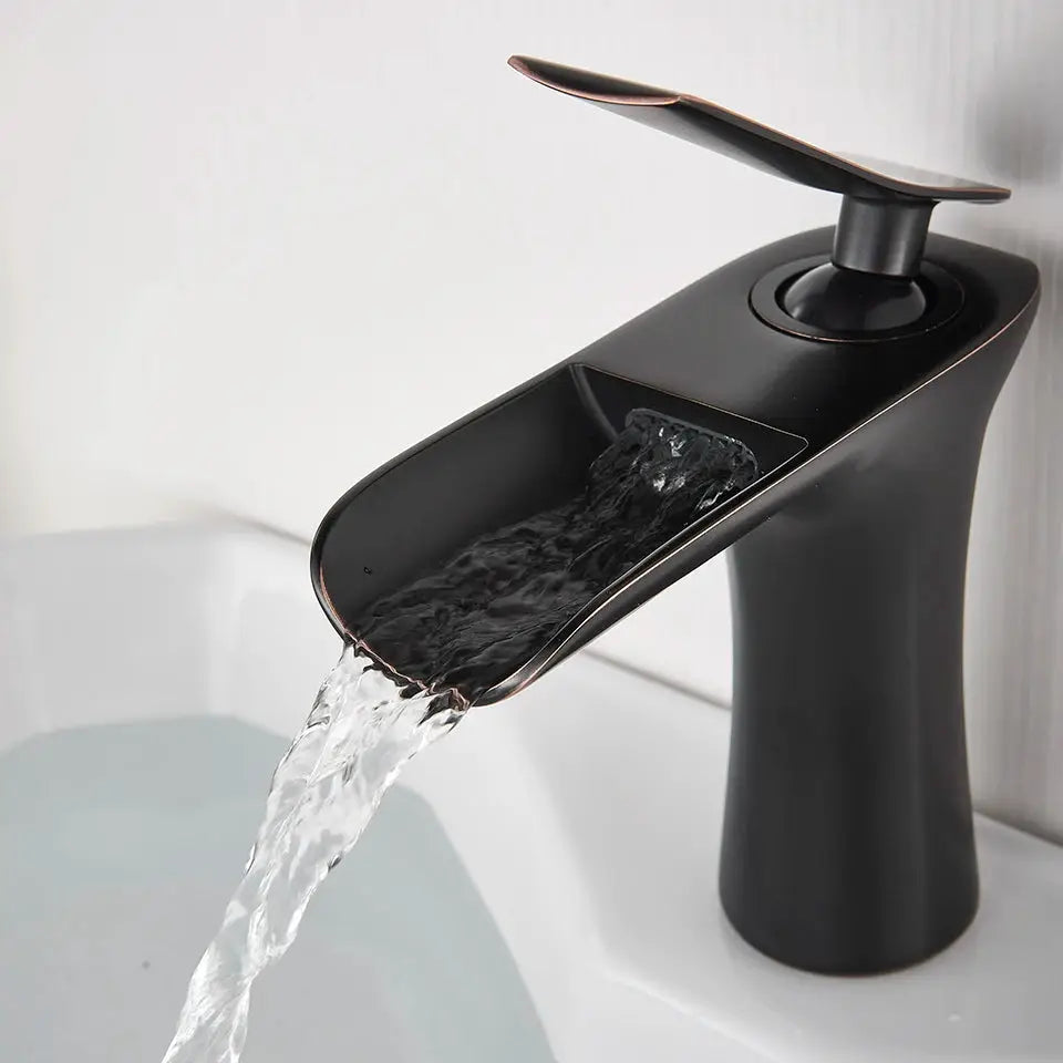 Basin faucet with waterfall spout, single-handle lever, matte black finish with copper trim