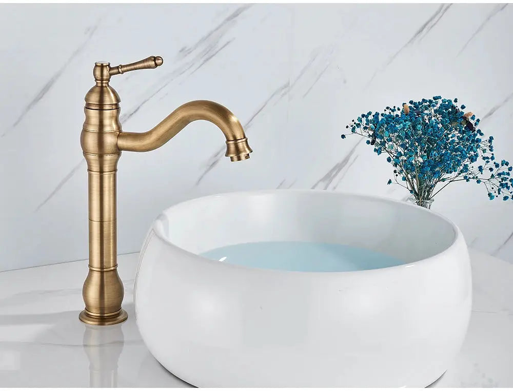 Simples Market antique brass basin faucet; deck-mounted, single-hole with curved spout
