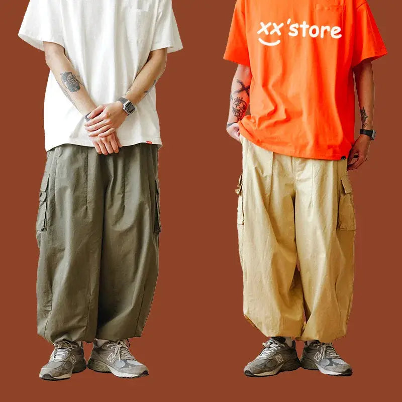 Cargo pants, oversized multi-pocket baggy trousers in olive green and beige worn by two models