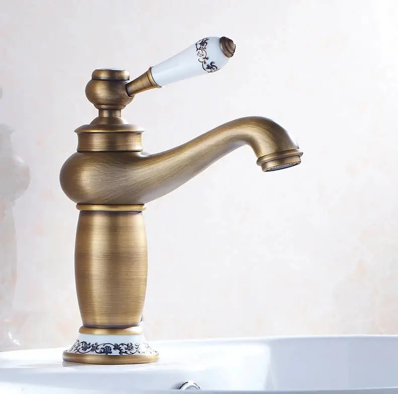Antique bronze bathroom faucet with single-handle lever, white porcelain knob, solid brass construction