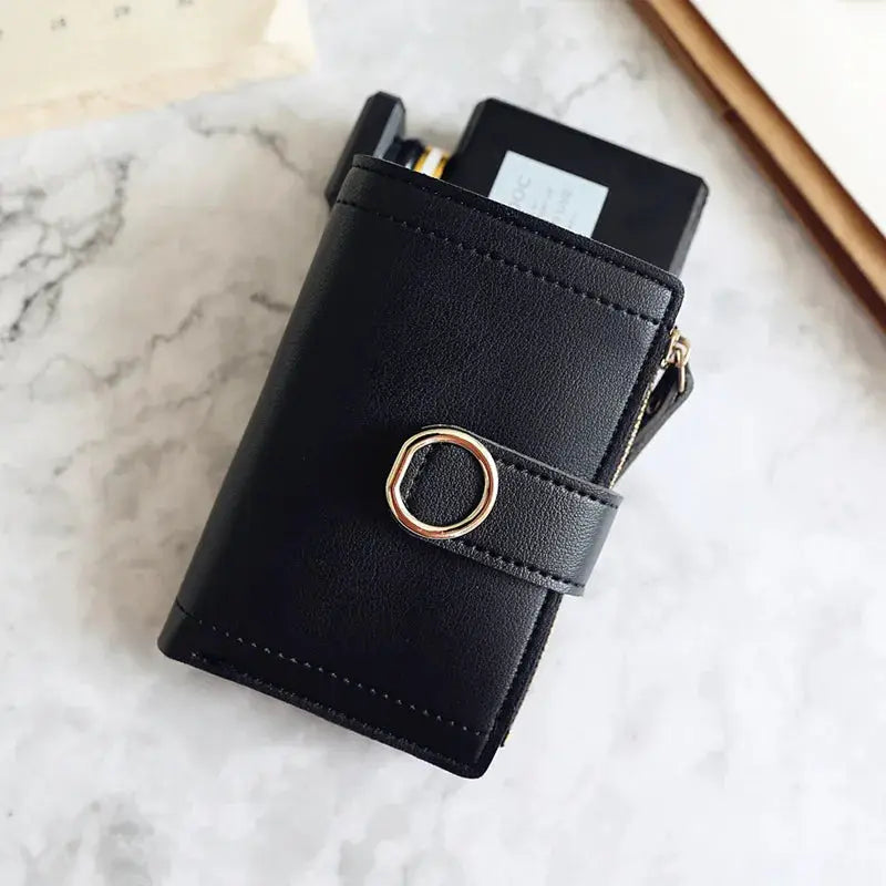 Simples Market black PU leather short wallet with zipper, wrap strap and gold ring accent