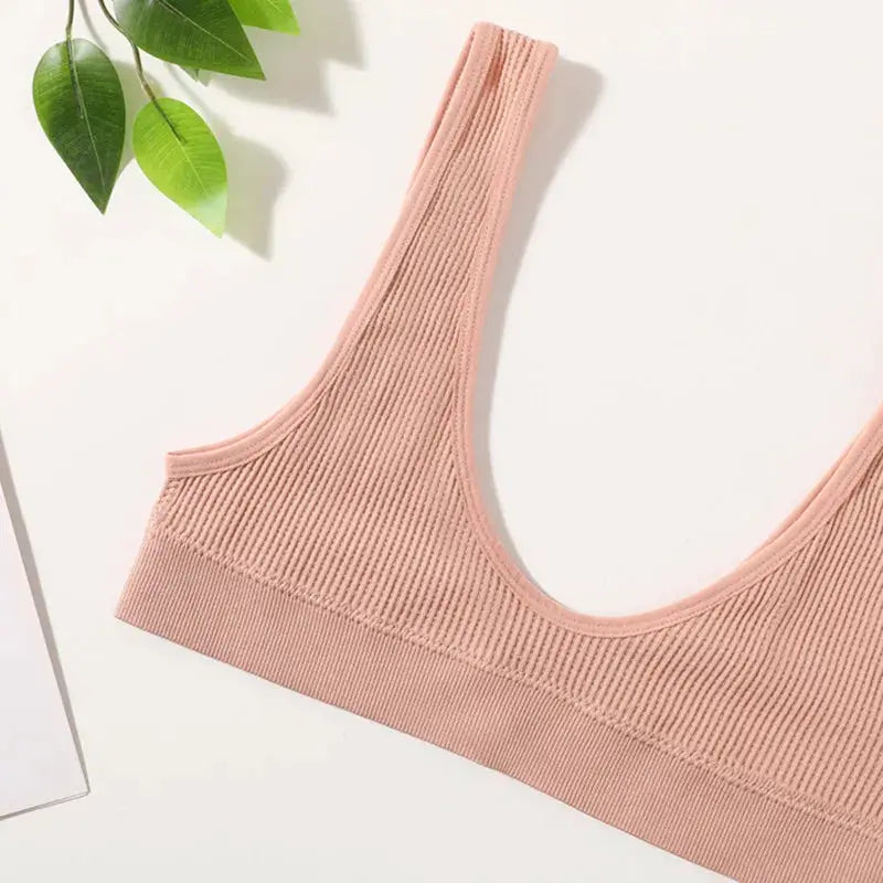 Women's seamless ribbed bralette crop top in pink, non-wire, deep-U shape.