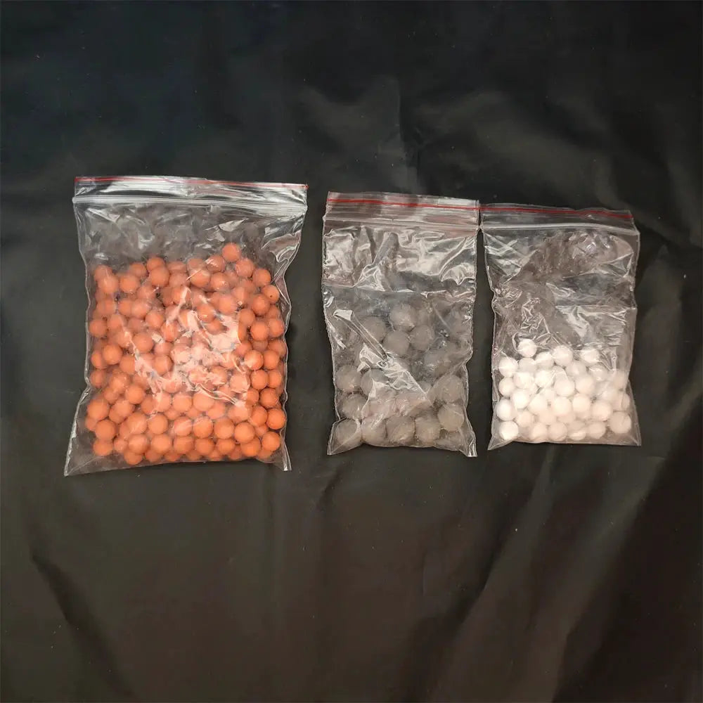 Shower head replacement beads set by Simples Market: three bags of orange, gray and white mineral ceramic balls