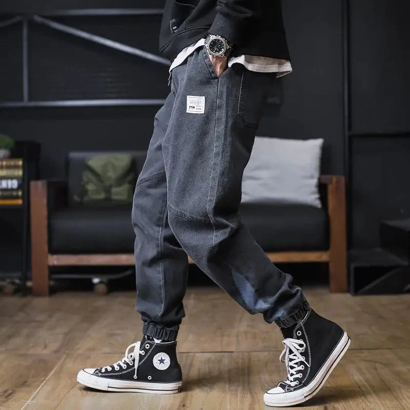 Plus size men's loose jogger cargo jeans, ankle-length dark denim with front thigh patch