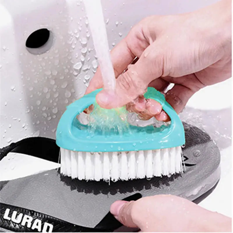 Colorful egg-shaped cleaning brush with turquoise handle and white bristles for bathroom and shoes