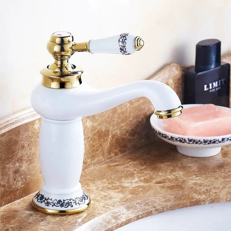 Antique brass bathroom faucet with white ceramic body and solid-brass single-handle lever