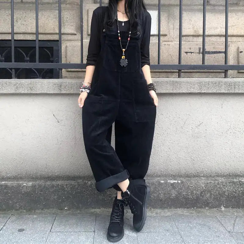 Corduroy women's black overalls with bib front, loose-fit jumpsuit and front pockets.