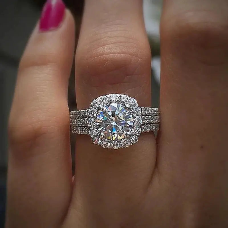 Huitan trendy women's engagement ring with large center cubic zirconia, halo and triple pavé bands