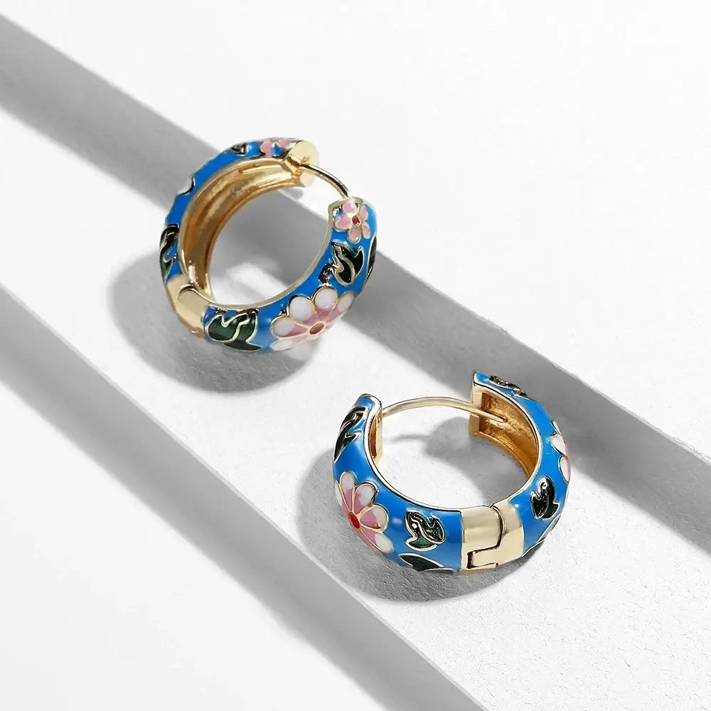 Pair of huggie hoop earrings with blue enamel and pink floral pattern, gold-tone interior, Simples Market