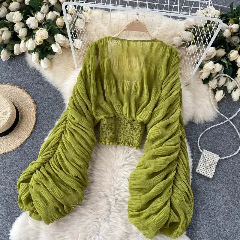 Summer draped chiffon blouse in green with puff long sleeves and smocked waist.