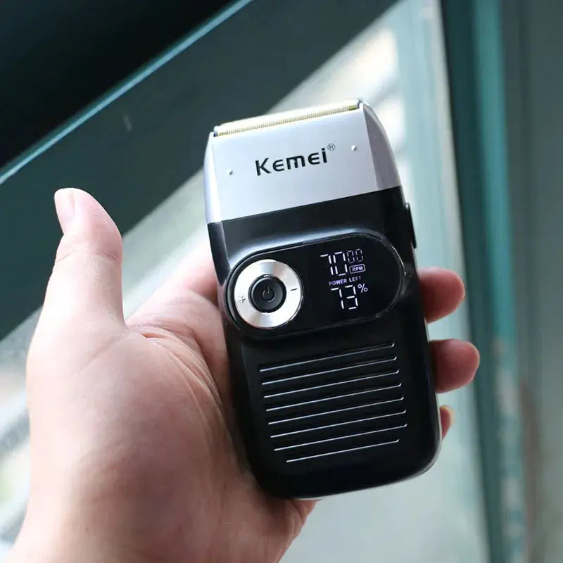 Kemei electric shaver handheld with black body and silver head, digital display