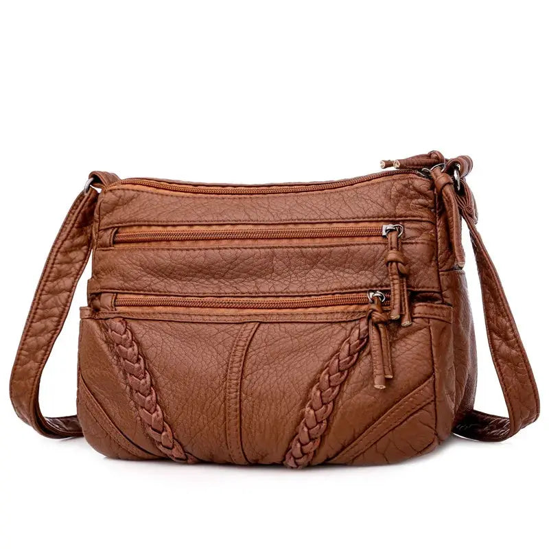 Simples Market women's messenger bag crossbody, brown PU leather with braided detailing and multiple zip pockets.