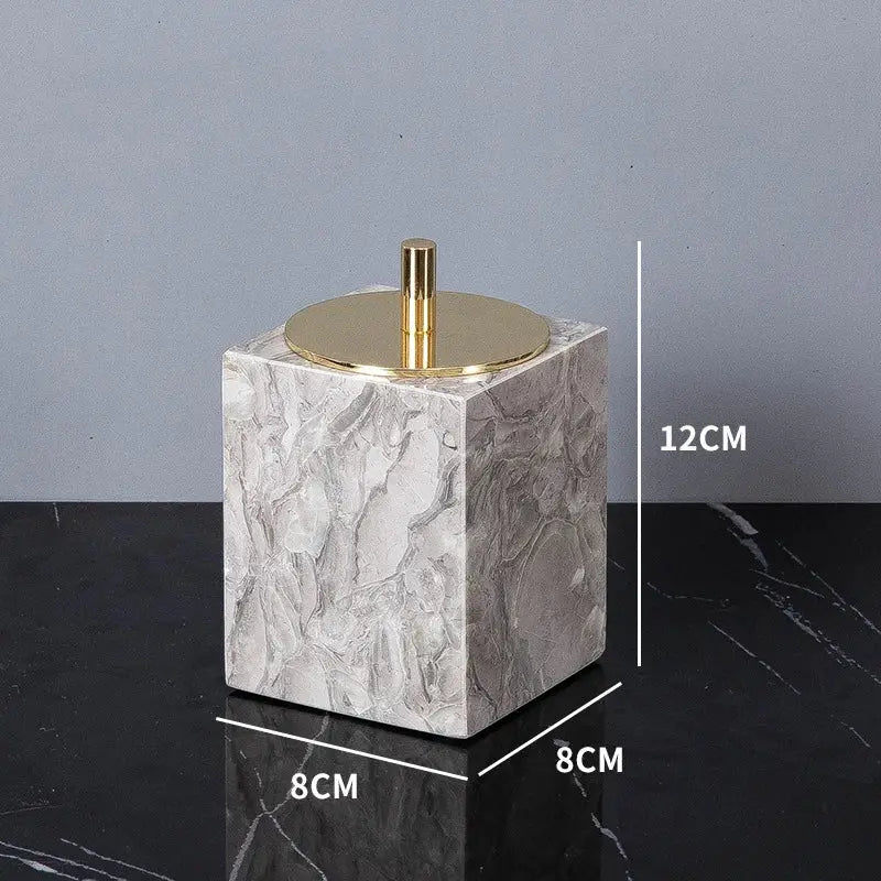 Bathroom marble soap dispenser by Simples Market with gold lid, cube-shaped natural marble