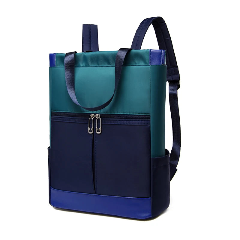 Simples Market women's waterproof Oxford backpack in teal, navy and royal blue with front zip pocket.