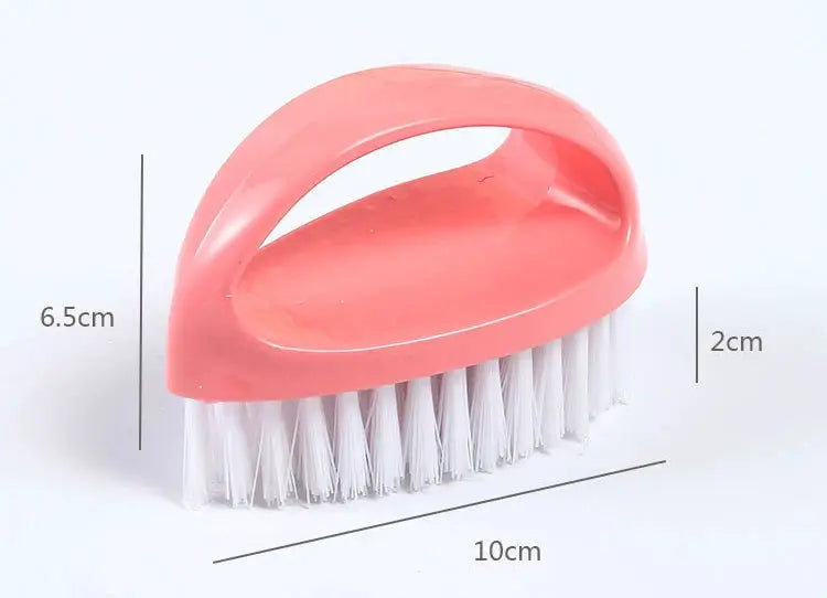 Pink egg-shaped cleaning brush with soft white bristles; 10 cm long for household use.