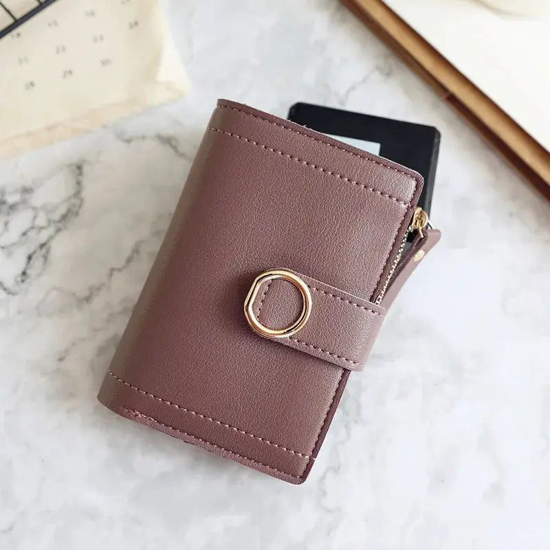 Women's mauve PU leather zip wallet with card holder and gold ring accent