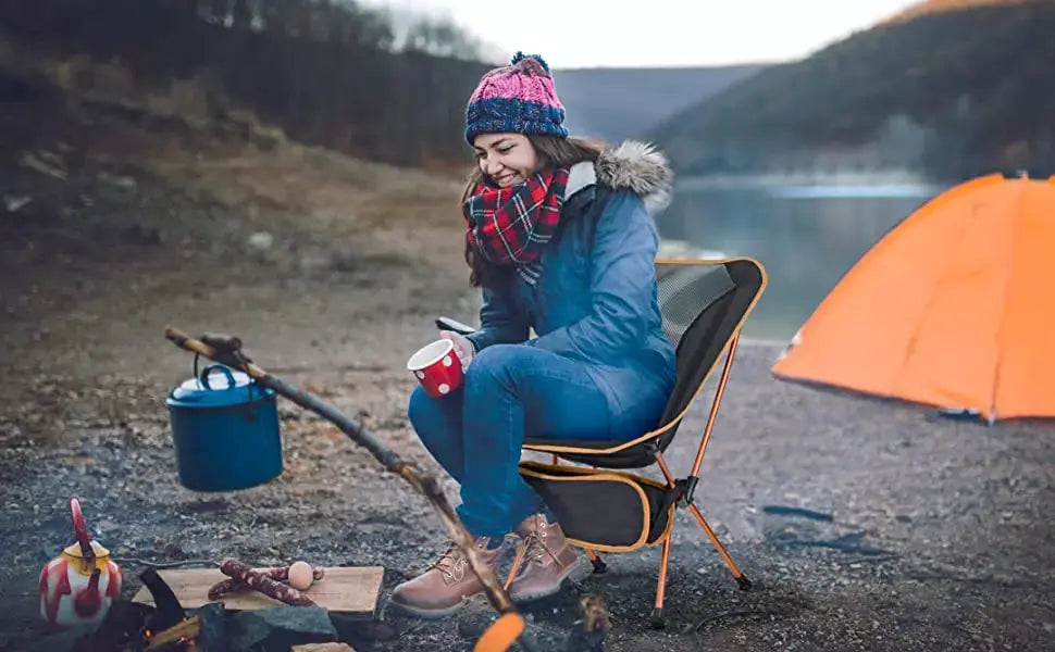 Folding ultralight camping chair with orange frame and black seat, Simples Market