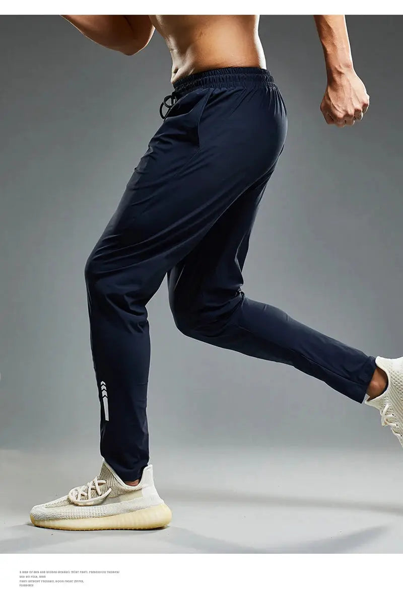 Men's navy Simples Market running jogger pants with elastic waistband and tapered fit