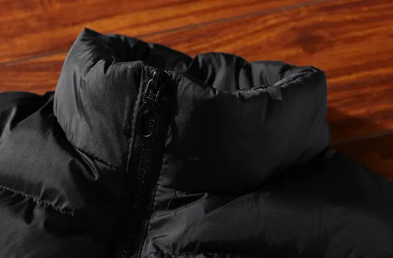 Men's black padded sleeveless vest with high collar and zipper closure