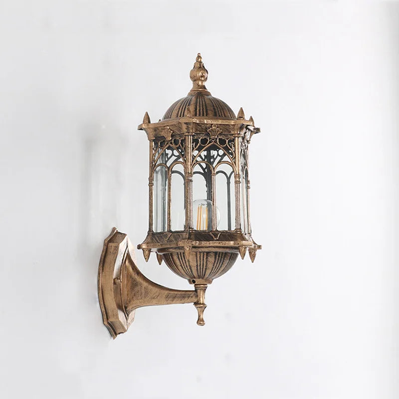 Bronze vintage outdoor wall lantern with glass panels and ornate metalwork