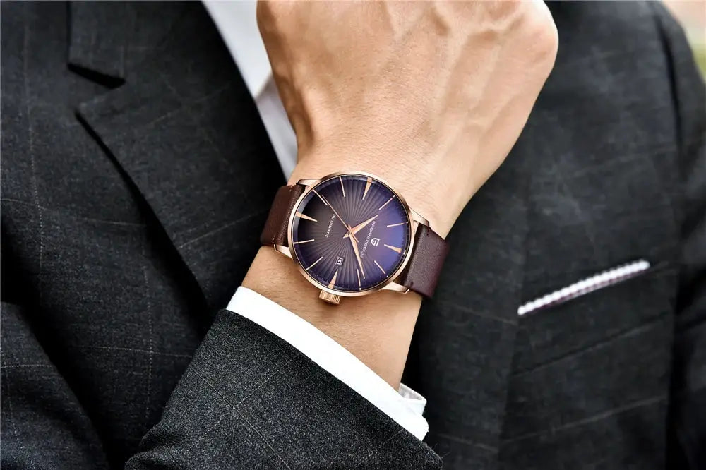 Pagani Design men's gold-tone wristwatch with brown leather strap and blue dial on a suit