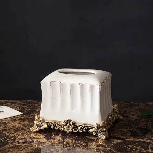 Tissue box cover, white ceramic with ornate gold base.