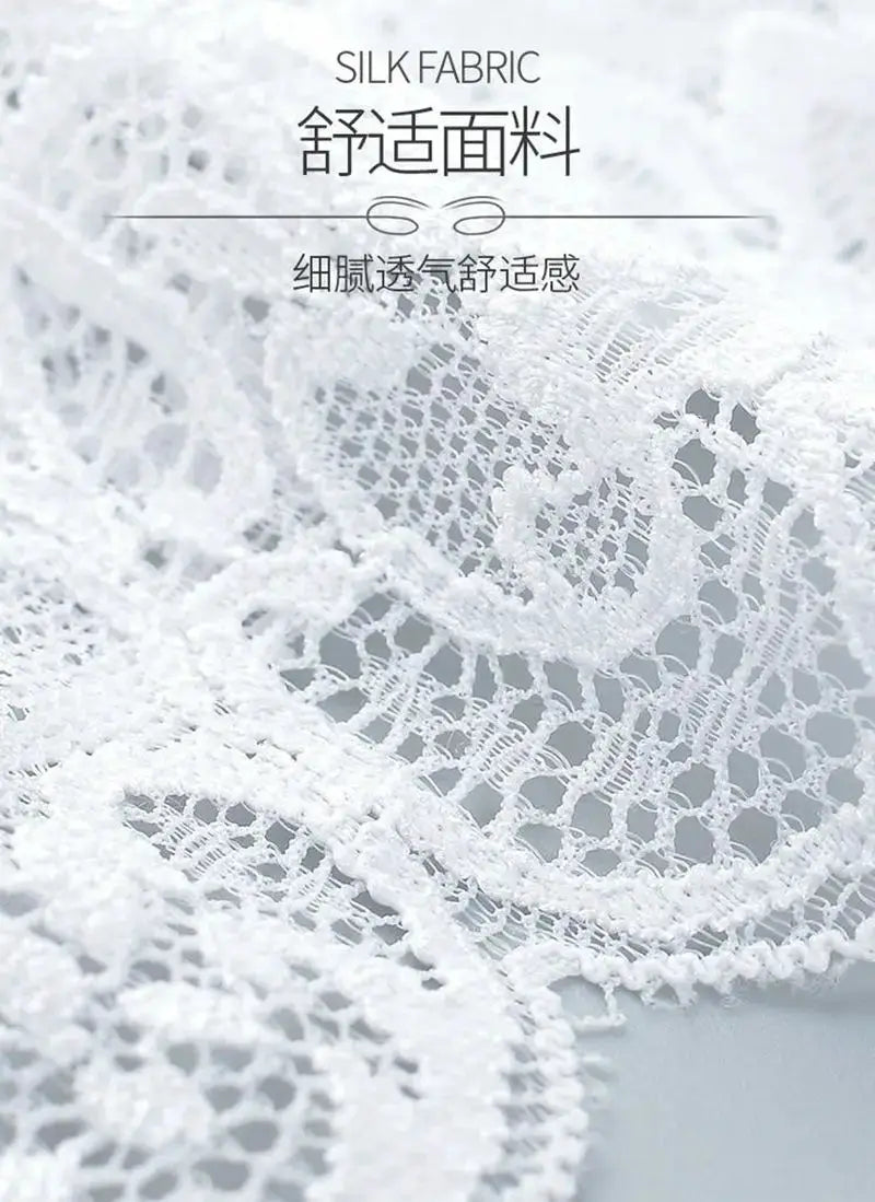 White silk lace fabric close-up with delicate mesh pattern