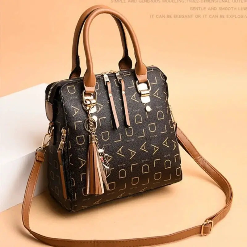 Fashion English Letter PU leather handbag with tassel top-handle, brown and black, large-capacity tote.