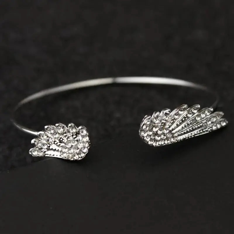 Adjustable silver open-cuff angel wing bracelet for women with crystal accents