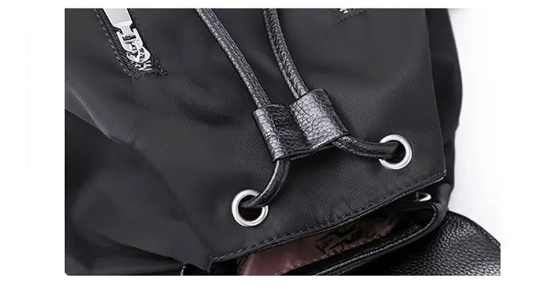 Simples Market nylon women's backpack with drawstring closure and metal grommets in black