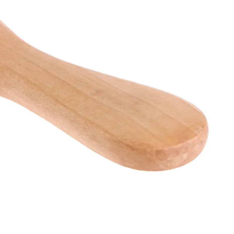 Wooden-handled baby hairbrush by Simples Market in natural wood finish.